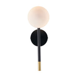 Wanda wall light with a round white glass orb shade on a black metal stem, brass-tipped base, and matching circular wall plate, shown on a plain white background.