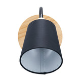 Juna Black Metal & Wood Wall Light with a round natural wood backplate, adjustable gooseneck arm, and black fabric cone shade, shown against a plain white background.