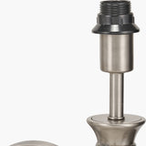 Close-up of the Salvatore wall light's antique silver metal fitting, showing the threaded socket, black lampholder, and tubular arm against a plain white background.