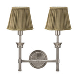 Salvatore double wall light in antique silver metal with two pleated olive fabric shades, twin arms on a round wall backplate, shown on a plain white background.