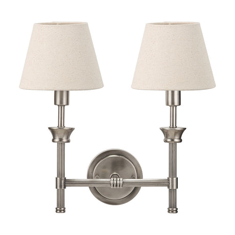 Salvatore double wall light in antique silver metal with two cream fabric tapered shades on curved arms, shown on a plain white background.