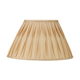 Empire lampshade in gold pleated silk mix fabric with brass trim, shown alone on a plain white background, part of the Tatiana wall light set.