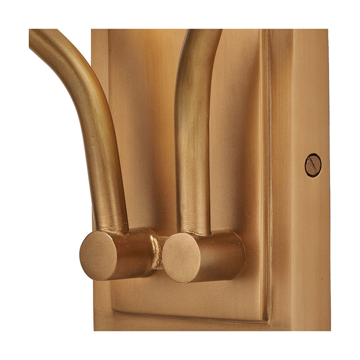 Close-up of the Tatiana Antique Brass Double Wall Light, showing two curved arms with cylindrical end caps on a rectangular backplate with visible fixing screw, set against a plain white background.