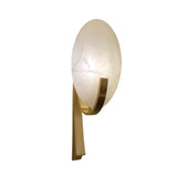 Mica 1 Light Disc Alabaster Wall Light with an oval natural stone shade cradled by a curved brushed brass arm, shown on a plain white background.