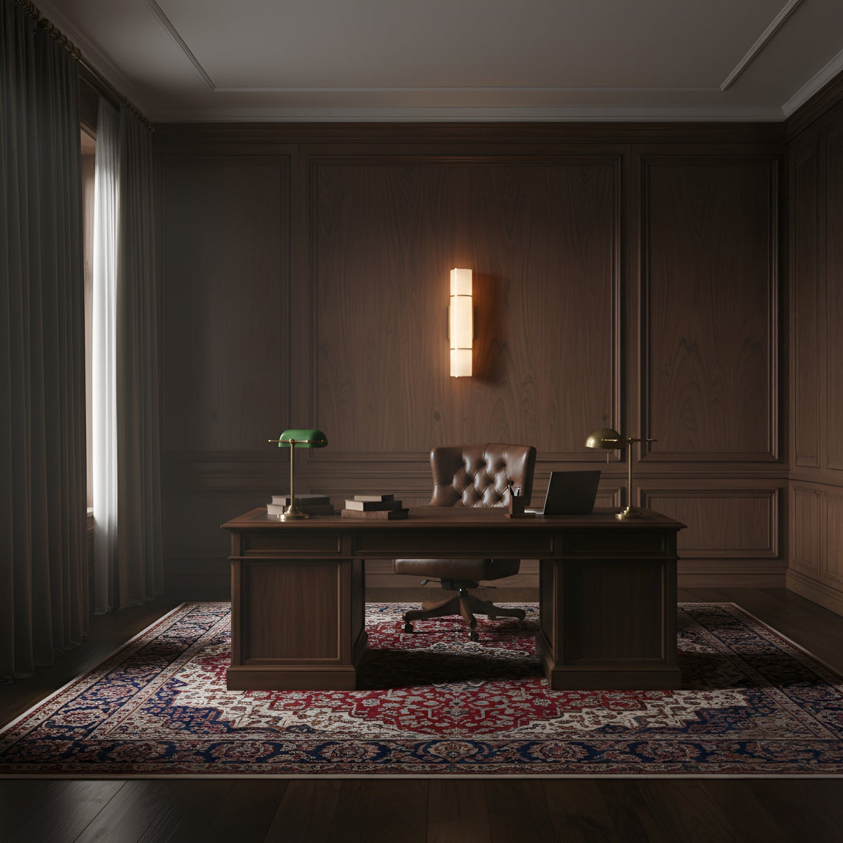 A classic wooden office features a large desk with a green banker’s lamp, books, and a laptop. An executive chair sits behind the desk, while an Almora LED Medium Cylinder Alabaster Wall Light adds sophistication above the decorative rug.