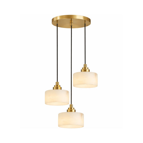 The Brinex 3 Light Cluster Alabaster Pendant Light in soft white and brushed brass features a round gold ceiling mount with three pendant lights on black cords at staggered lengths, each adorned with frosted cylindrical shades.