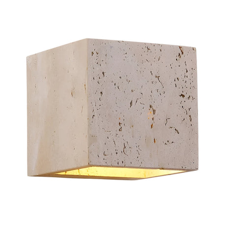 The Cavaro LED Cube Travertine Wall Light in light beige features a cube-shaped travertine exterior and warm LED glow from the open bottom, offering modern elegance to any space.