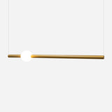 The Sottile LED Combination Suspension Light in Gold showcases minimalist design with its sleek, horizontal brass rod and single glowing white bulb, offering a touch of contemporary luxury against a crisp white background.