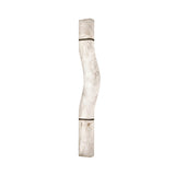 Caterris LED alabaster wall light from Niori with tall sculptural wavy profile, soft white stone panels and matt black banded detailing on a white background.