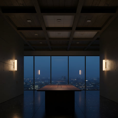 A modern, dimly lit room with a large wooden table features floor-to-ceiling windows and is elegantly illuminated by Valmere LED Medium Linear Alabaster Wall Lights in soft white on both sides of the space.