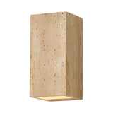 The Cavaro LED Rectangular Travertine Wall Light in light beige features a textured stone finish and emits LED light from the bottom, shown here against a white background.