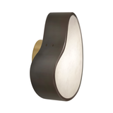 The Marea LED Alabaster Wall Light in matte black features a rounded, asymmetrical frame, soft white diffuser, and brass mounting plate—shown against a plain white background.