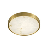 The Bravion LED Medium Round Alabaster Flush Ceiling Light in soft white and brushed brass is shown from below, featuring a brushed brass frame and an alabaster-effect diffuser against a plain background.