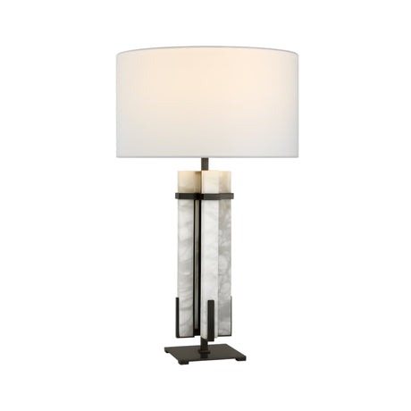 The Pilaster 1 Light Column Alabaster Table Lamp features a matte black and soft white finish, a cylindrical shade, and a rectangular base with vertical marble-like alabaster panels and sleek black metal accents for a modern look.