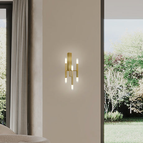 TheLight LED Wall Light in satin gold finish with three slim iron arms lit at both ends by frosted acrylic diffusers, mounted on a bedroom wall.
