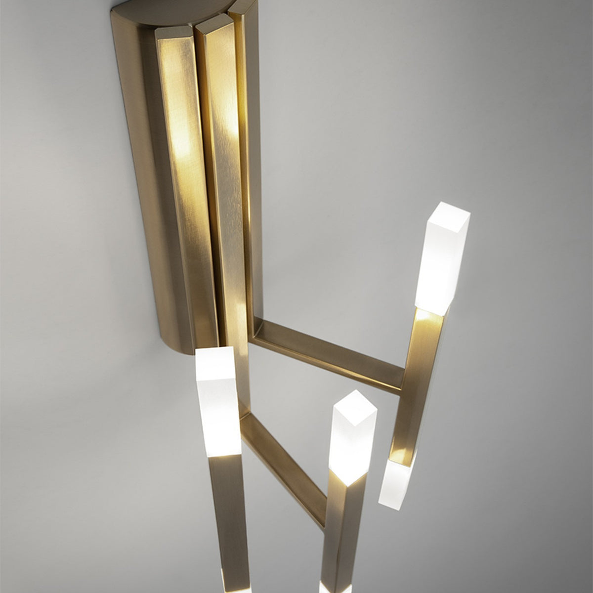 TheLight LED Wall Light in satin gold finish, featuring three slim square-section iron arms with frosted acrylic diffusers lit at each end, mounted on a fluted backplate.