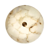 The Veltrix LED Medium Round Alabaster Flush Ceiling Light features a mosaic of translucent white and beige alabaster, softly backlit in soft white, with a brushed brass center accent.