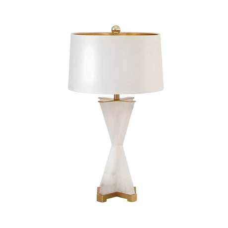 The Astren 1 Light Crossed Alabaster Table Lamp features a brushed brass finish, soft white cylindrical shade, and elegant gold accents on the base and finial for a modern, sophisticated look.
