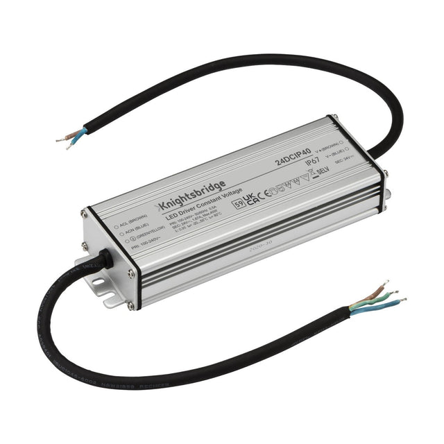 A rectangular metal LED driver features two attached black cables and is encased with specifications, such as the brand Knightsbridge and input-output voltage details. The 40W Constant Voltage LED Driver 24V IP67 provides reliable protection with its IP67 rating.