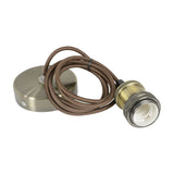 LYYT ES pendant set by AVSL with E27 antique brass lamp holder, knurled detailing, 1.8m brown braided cord, and round steel ceiling rose on white.