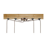 LYYT 4P-E27-ACP 4-light pendant set with antique copper ceiling rose and four braided cables spread across a wooden ceiling beam via rubber pads.