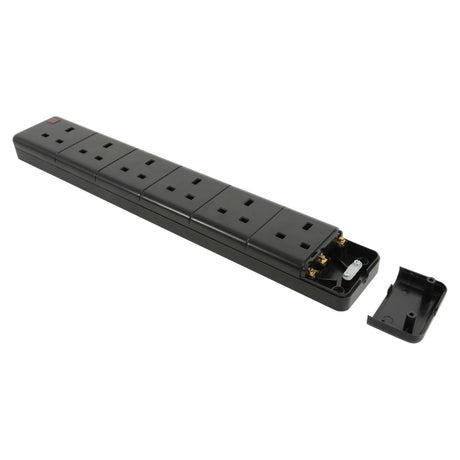 A Mercury 6 Gang 13A Trailing Socket - Black is shown with its end cover removed, exposing the internal wiring and components. The detached cover is placed next to the wall-mountable extension socket.