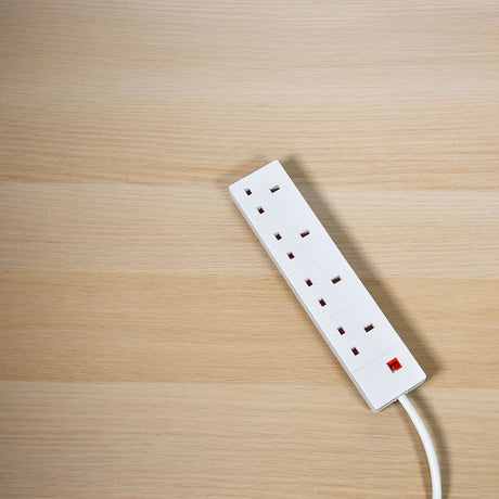 AVSL Mercury 4 gang extension lead in white with four UK 13A sockets, red neon indicator and 3m cable, shown on a light wood surface.