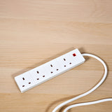 AVSL Mercury 4-gang white extension lead with four 13A UK sockets, red neon indicator and 3m cable, shown on a light wood surface.