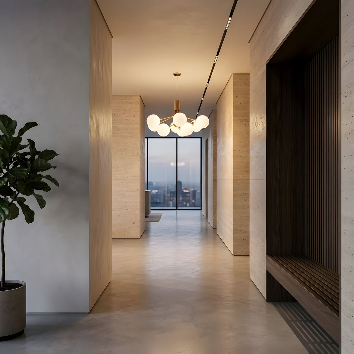 A modern hallway with minimalist decor, light wood walls, a potted plant, a built-in bench, and an Ivy 9 Light Chandelier - Brass. Large windows at the end showcase a cityscape at dusk.