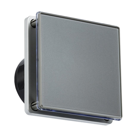 Close-up of a modern, square-shaped wall light fixture featuring a sleek, metallic finish and a transparent frame, perfectly paired with the 100mm/4" LED Backlit Extractor Fan With Overrun Timer in Grey. The light is slightly angled upward to highlight its minimalist design while complementing the fan's low-noise ventilation.