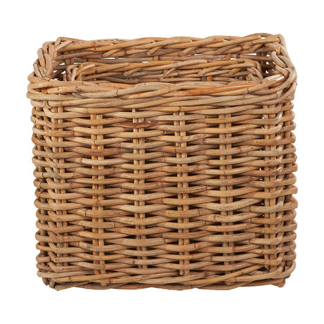 Chunky rattan rectangular log basket with tightly woven sides and rolled rim, shown in a natural unpainted finish against a plain white background.