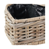 Close-up of the Tobs grey Kubu rattan basket planter, showing woven rattan sides, a whipped rim edge, and black plastic liner visible inside.