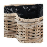 Close-up of the Tobs grey Kubu rattan heart-shaped basket planter, showing woven rattan sides and a black plastic liner visible at the rim.