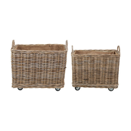 Set of two grey Kubu rattan rectangular log baskets with jute liners, wicker handles and castor wheels, shown on a plain white background.