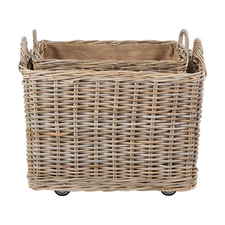 Grey Kubu rattan rectangular log basket with woven handles, hessian lining, and castor wheels, shown on a plain white background.