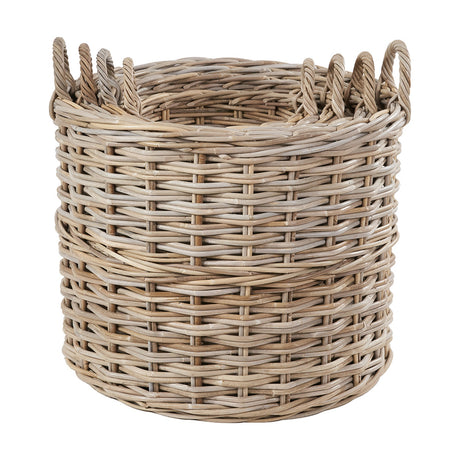 Tall round storage basket in pale grey Kubu rattan with woven sides and looped side handles, shown on a plain white background.