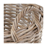 Close-up of the Tobs 56cm grey rattan log basket, showing the twisted woven handle and open lattice weave in soft grey tones.