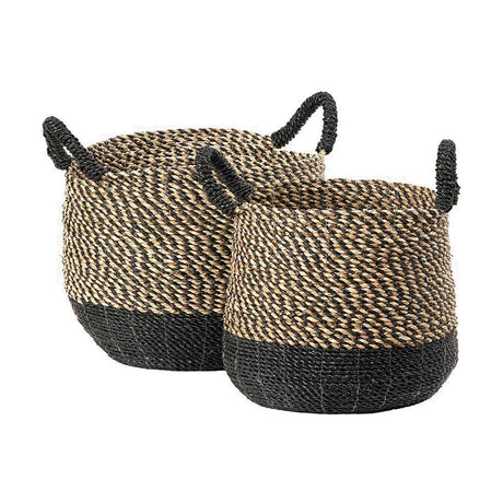 Set of 2 seagrass storage baskets with black woven handles, natural and black chevron-pattern weave and black base, shown on a plain white background.