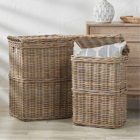 Set of 2 grey Kubu rectangular linen baskets, 70cm tall woven rattan hampers with lift-off lids, shown in a room beside a wooden cabinet.