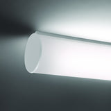 Bath A LED Linear Flush Wall & Ceiling Light in white, showing an illuminated opal polycarbonate tube with a round white end cap, mounted near a ceiling corner.
