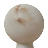 The Talorin 1 Light Sphere Column Alabaster Table Lamp in soft white features a smooth, round alabaster sphere with brown and beige marbling atop a matching cylindrical base, creating an elegant accent against a plain white background.
