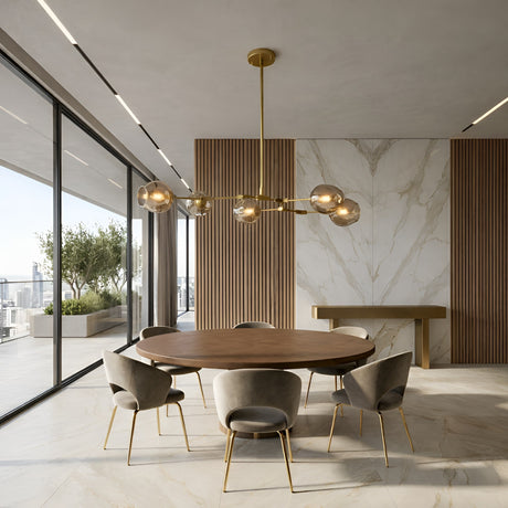 Niori Tree 5 Light Suspension in Gold with smoked glass shades on curved arms, hanging above a round wooden dining table in a modern room.