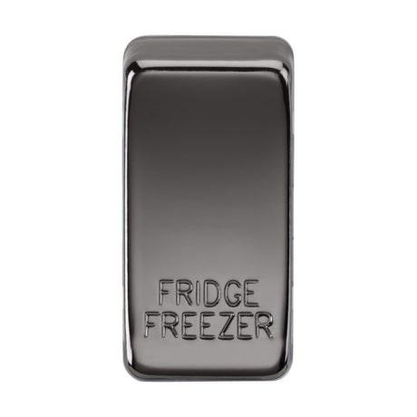 A sleek black nickel switch cover featuring the words "FRIDGE FREEZER" embossed on it. The reflective, rectangular design includes rounded edges.