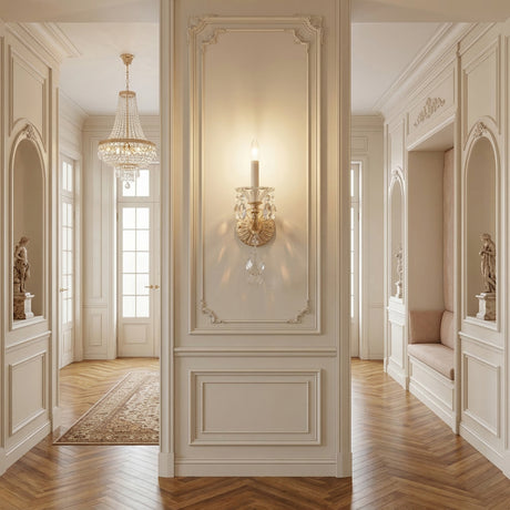 Elegant hallway with ornate Rococo wall paneling, the Vienna 1 Light K9 Crystal Wall Light in heirloom gold, parquet wood floors, classical statues in alcoves, a chandelier, and tall glass doors that fill the space with natural light.