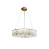 The Valeris 10 Light Layard Panel Alabaster Chandelier in Soft White & Brass features a modern circular design with a gold ceiling mount and slim cables, showcasing translucent alabaster panels that softly diffuse the light.