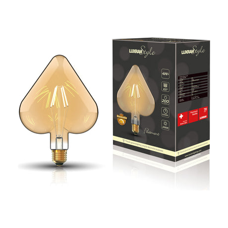Heart-shaped E27 LED filament bulb in amber glass with visible filaments and brass-tone base, shown beside its retail box, 4W dimmable, 2100K, on a white background.