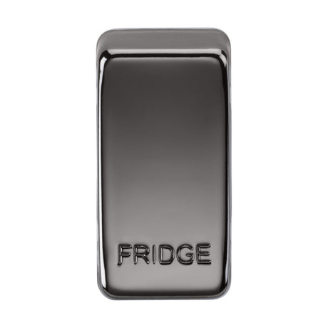 Introducing the Switch Cover "Marked FRIDGE" - Black Nickel: a sleek, metallic fridge magnet featuring a reflective surface and a black nickel finish. The word FRIDGE is stylishly embossed on the bottom half of its rectangular shape, complete with rounded edges. Crafted from durable ABS construction, this design ensures long-lasting appeal.