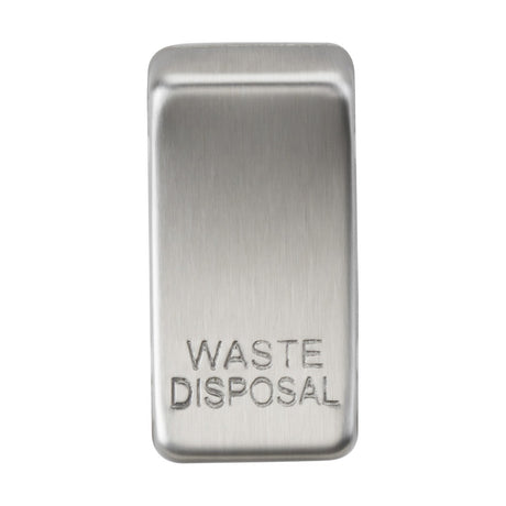 A rectangular switch cover with a brushed chrome finish, labeled "WASTE DISPOSAL" in embossed letters. The sleek, modern design indicates that it is part of a larger appliance or device with interchangeable rocker covers for added versatility.