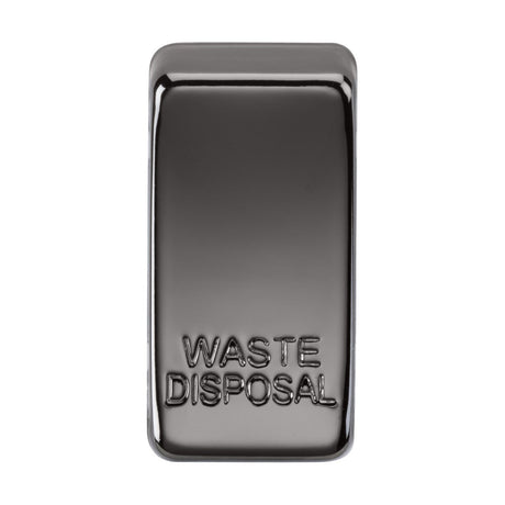 A Switch Cover "Marked WASTE DISPOSAL" in black nickel features a sleek, rectangular design with the words WASTE DISPOSAL embossed on the surface. Its interchangeable functionality makes it compatible with diverse settings.