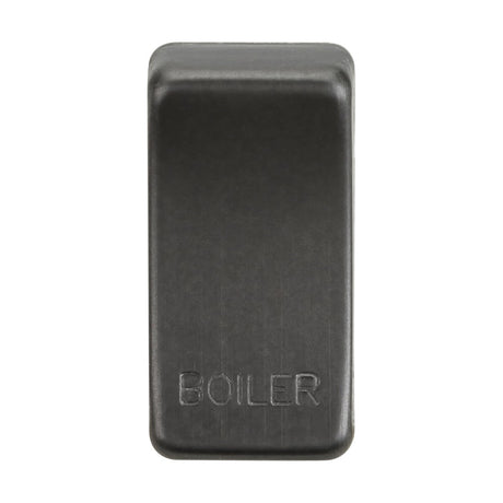 A rectangular button in a smoked bronze finish marked "BOILER," featuring interchangeable rocker covers, with a slightly raised surface and a smooth texture.